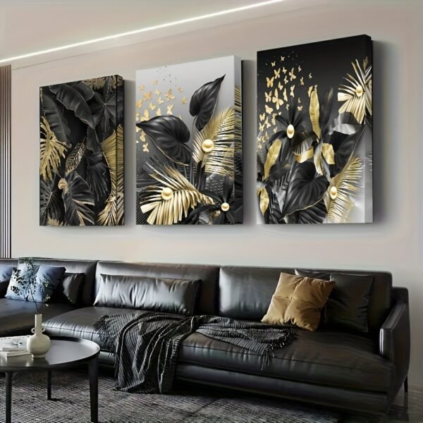 لوحات حائط مودرن أسود وذهبي (2) لوحات حائط مودرن أسود وذهبي – طقم 3 قطع بتصميم أوراق نباتية فاخرة