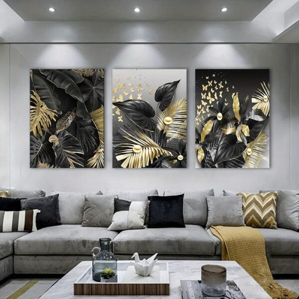 لوحات حائط مودرن أسود وذهبي (3) لوحات حائط مودرن أسود وذهبي – طقم 3 قطع بتصميم أوراق نباتية فاخرة